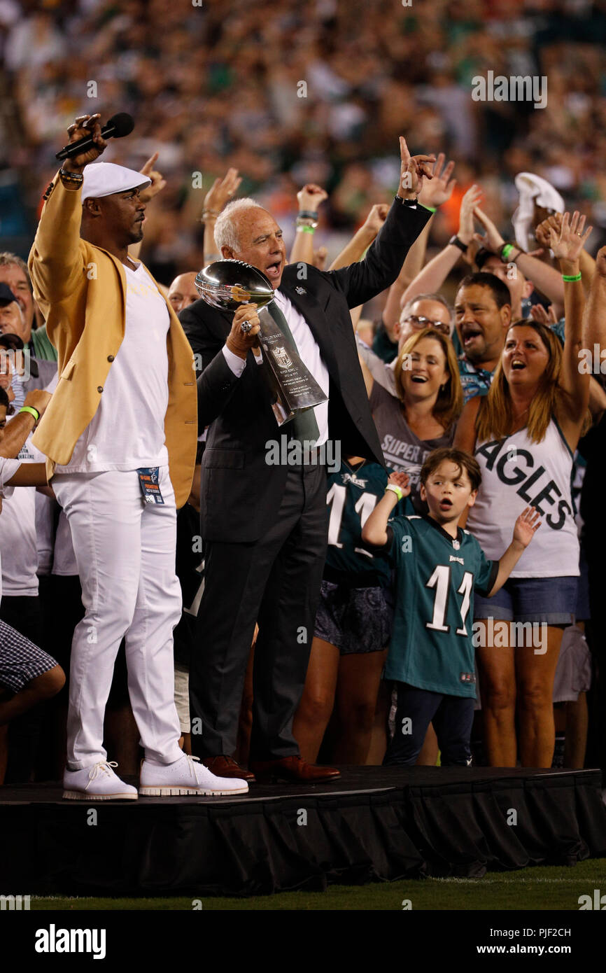 Philadelphia, Pennsylvania, USA. 6th Sep, 2018. Philadelphia Eagles owner Jeffery Lurie celebrates with the Lombardi Trophy with NFL Hall of Famer Brian Dawkins and fans prior to the NFL game between the Atlanta Falcons and the Philadelphia Eagles at Lincoln Financial Field in Philadelphia, Pennsylvania. Christopher Szagola/CSM/Alamy Live News Stock Photo