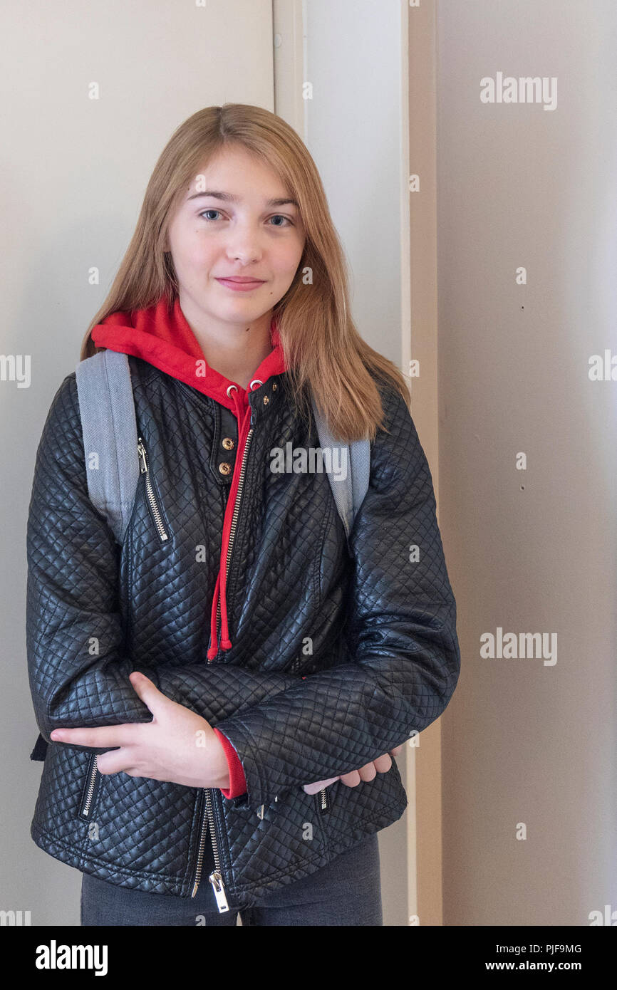 Portrait of beautiful happy smiling Swedish female 15-year old teenager ready to leave for first day of college Stock Photo