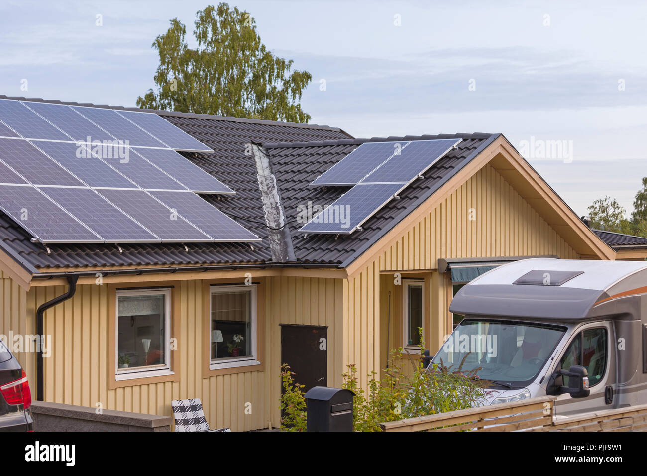 Picture of Solar panels on top of roof tiles on typical swedish or scandinavian ...