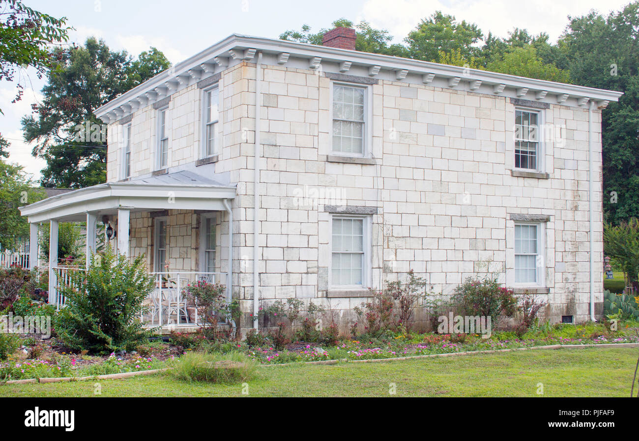 In Petersburg, Virginia, a curious house was built using old discarded gravestones—an eerie and unusual piece of architectural history. Stock Photo