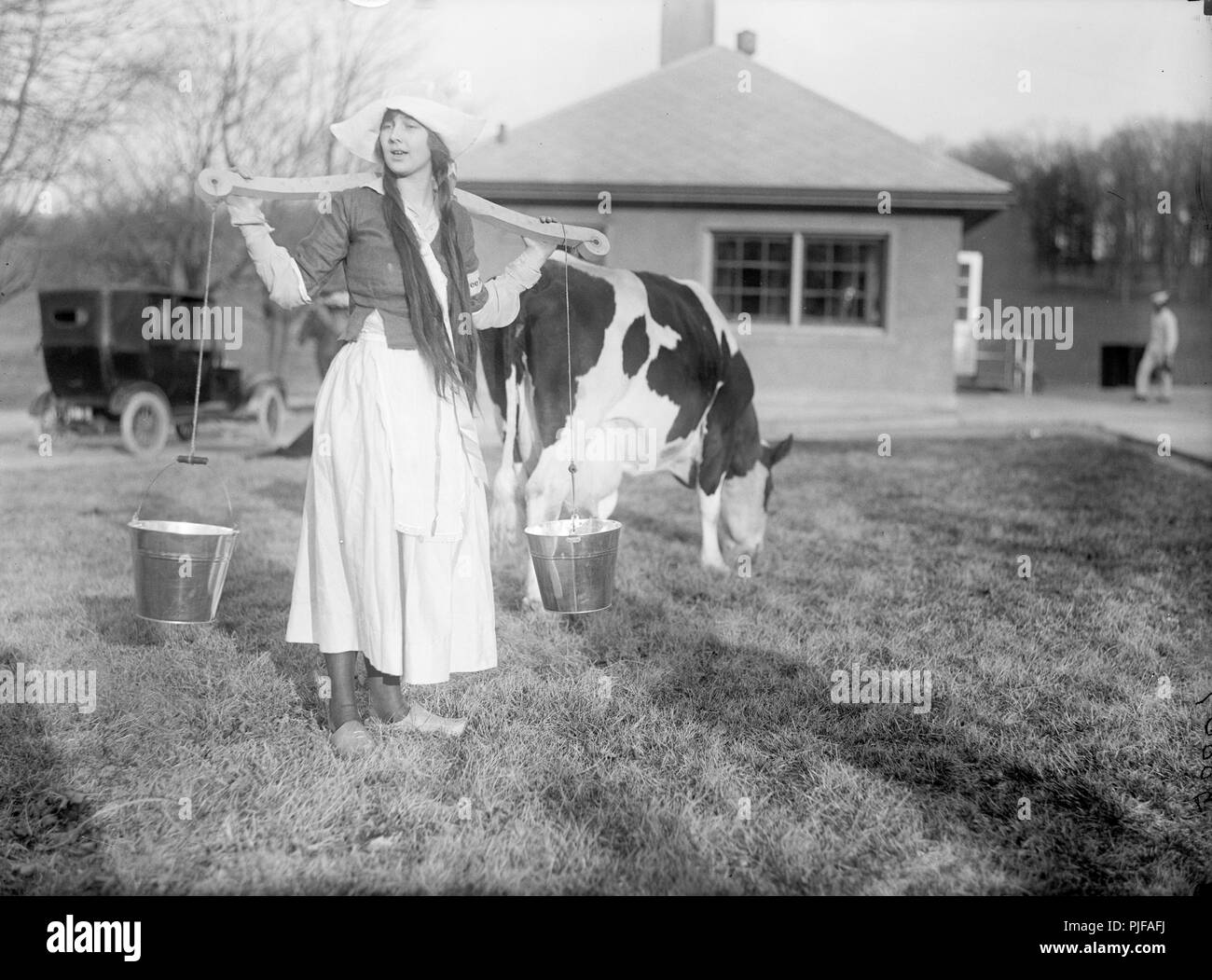 Dutch Dairy Maid with cow, Milkmaid or milk maid Stock Photo