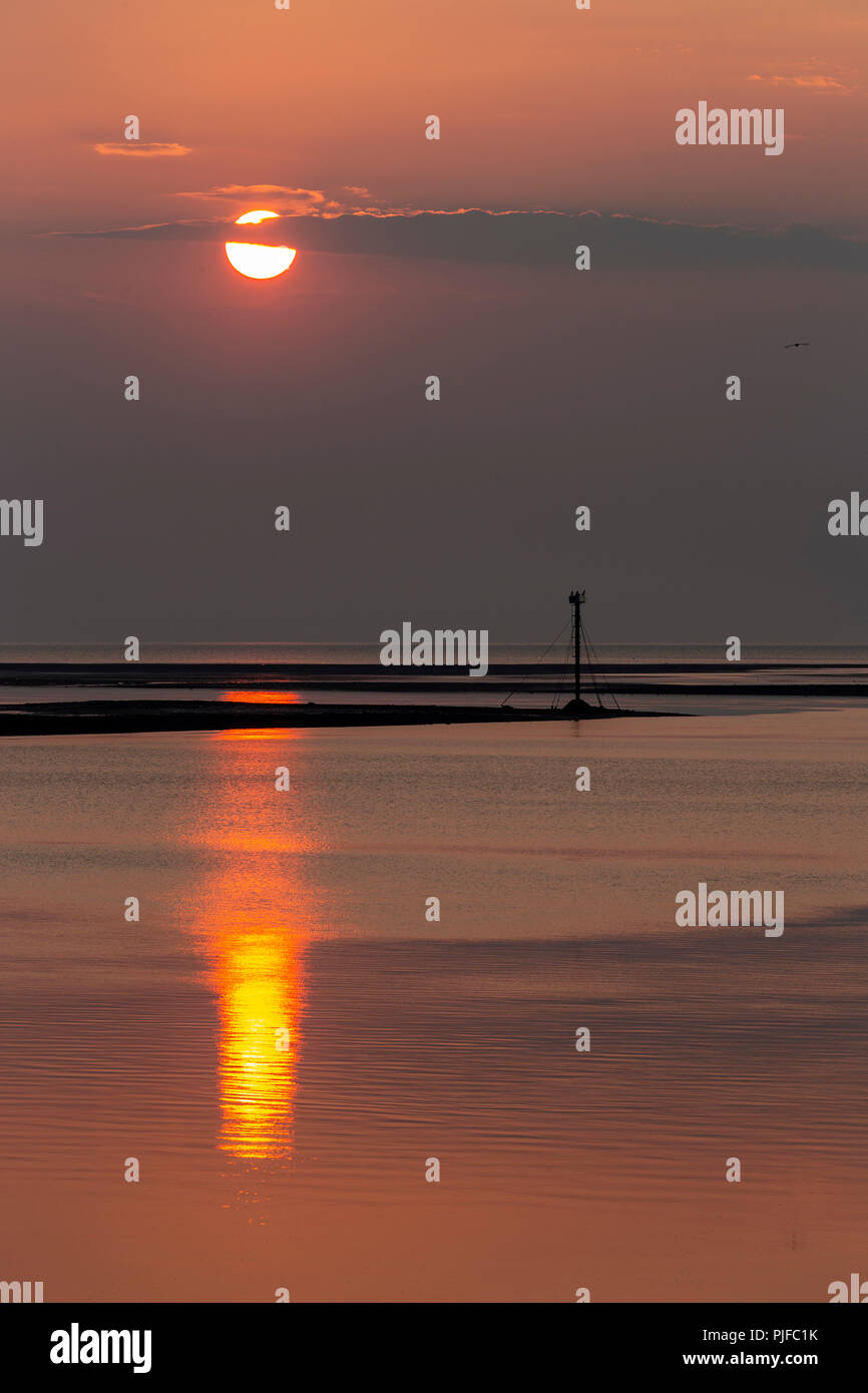 Sunset over the Irish Sea from Deganwy on the North Wales coast Stock Photo