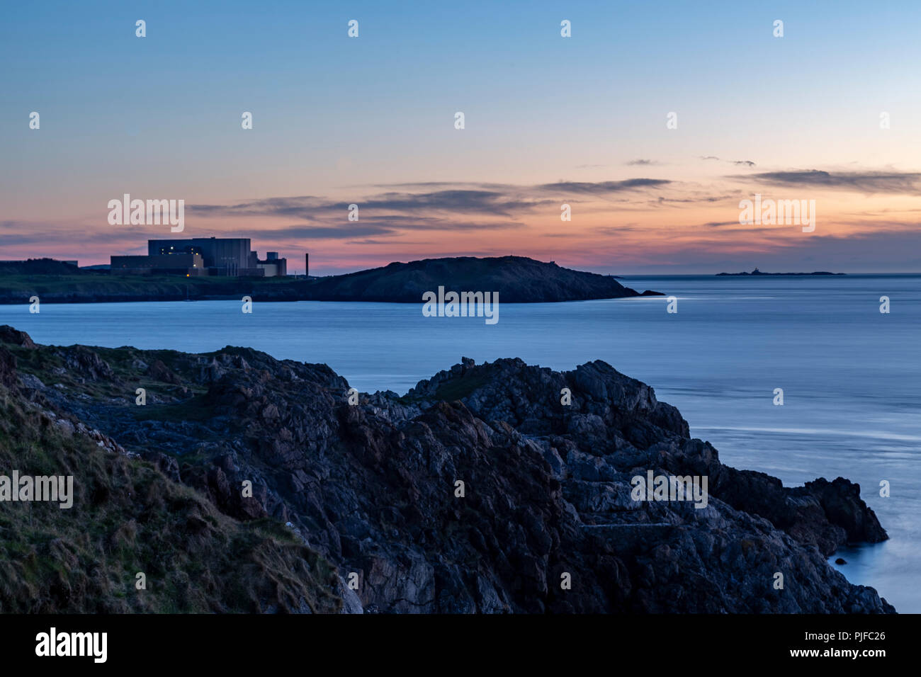 Wylfa nuclear power station at dusk, Anglesey on the North Wales coast Stock Photo