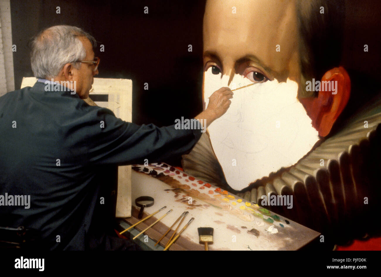 Mario Rueda Billboard painter Mario Rueda working on a billboard that reproduces a ...