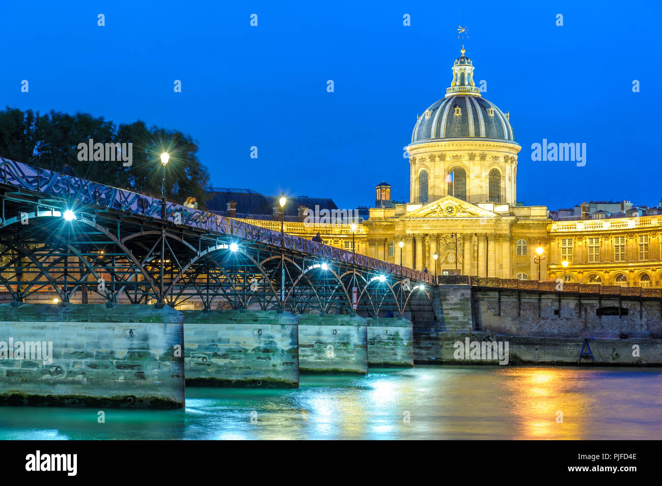 night scene of National Residence of the Invalids and the pont des arts Stock Photo