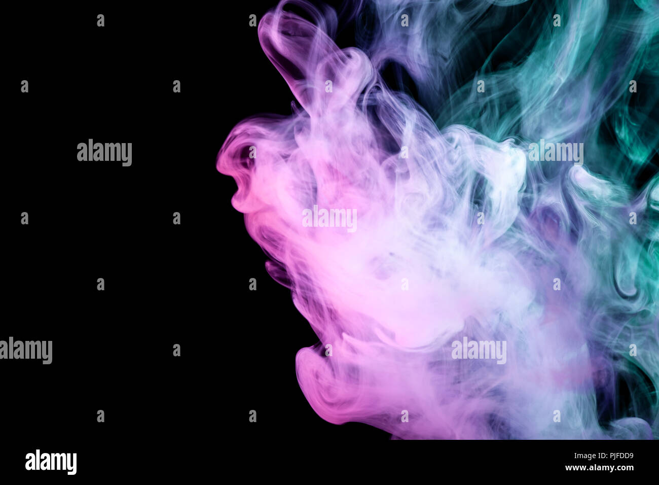 Pink, green and blue cloud smoke on black isolated background Stock ...