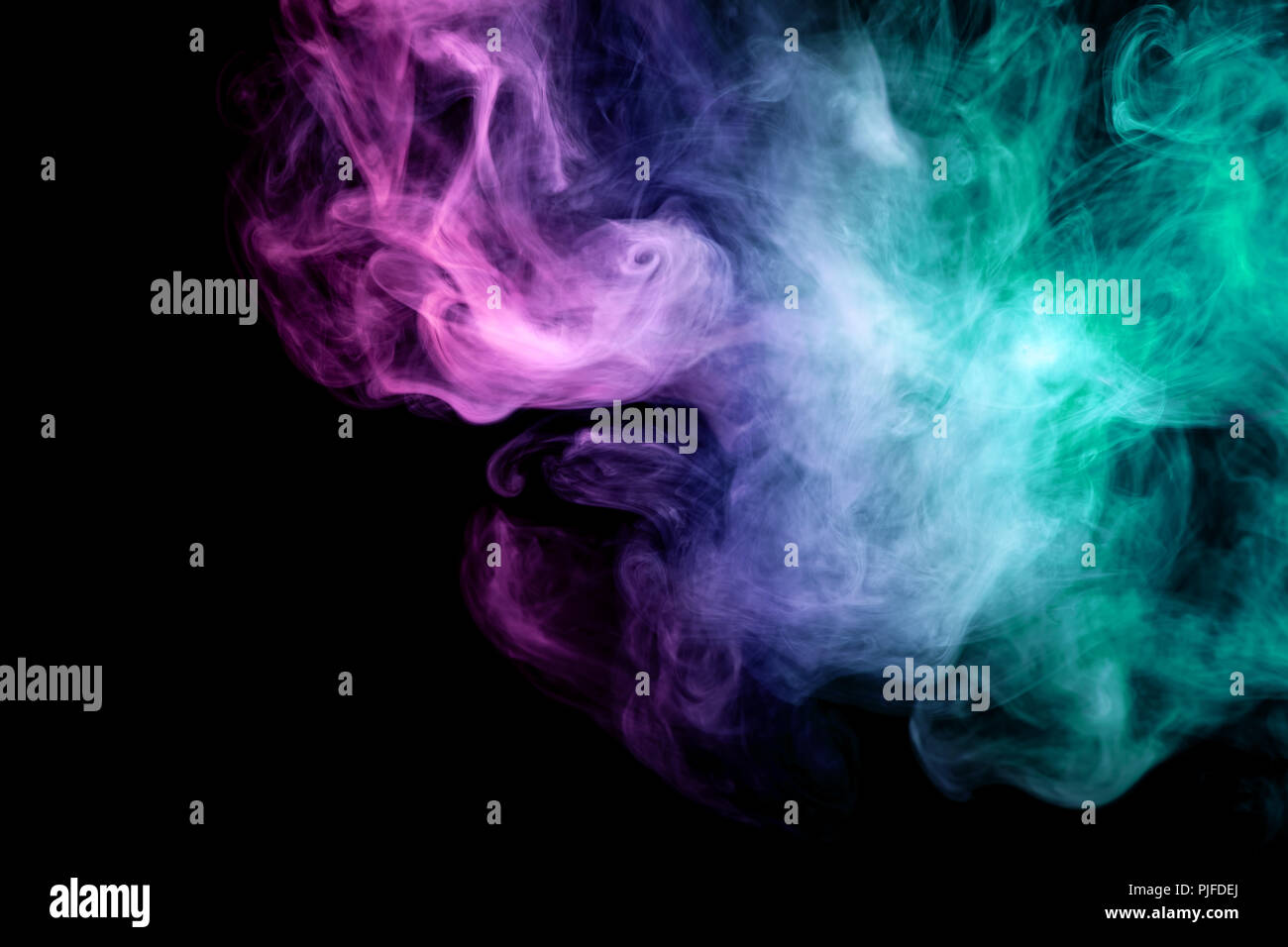 Pink, green and blue cloud smoke on black isolated background Stock ...