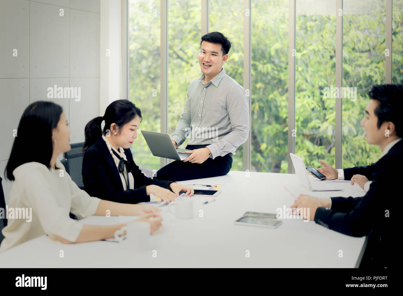 Asian businessman present business report at meeting room in office. Business present and meeting concept. Stock Photo