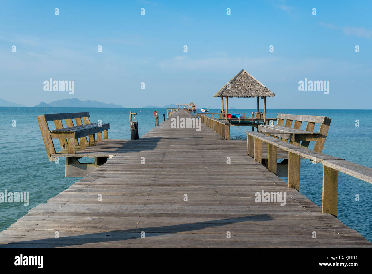Wooden pier with boat in Phuket, Thailand. Summer, Travel, Vacation and Holiday concept. Stock Photo