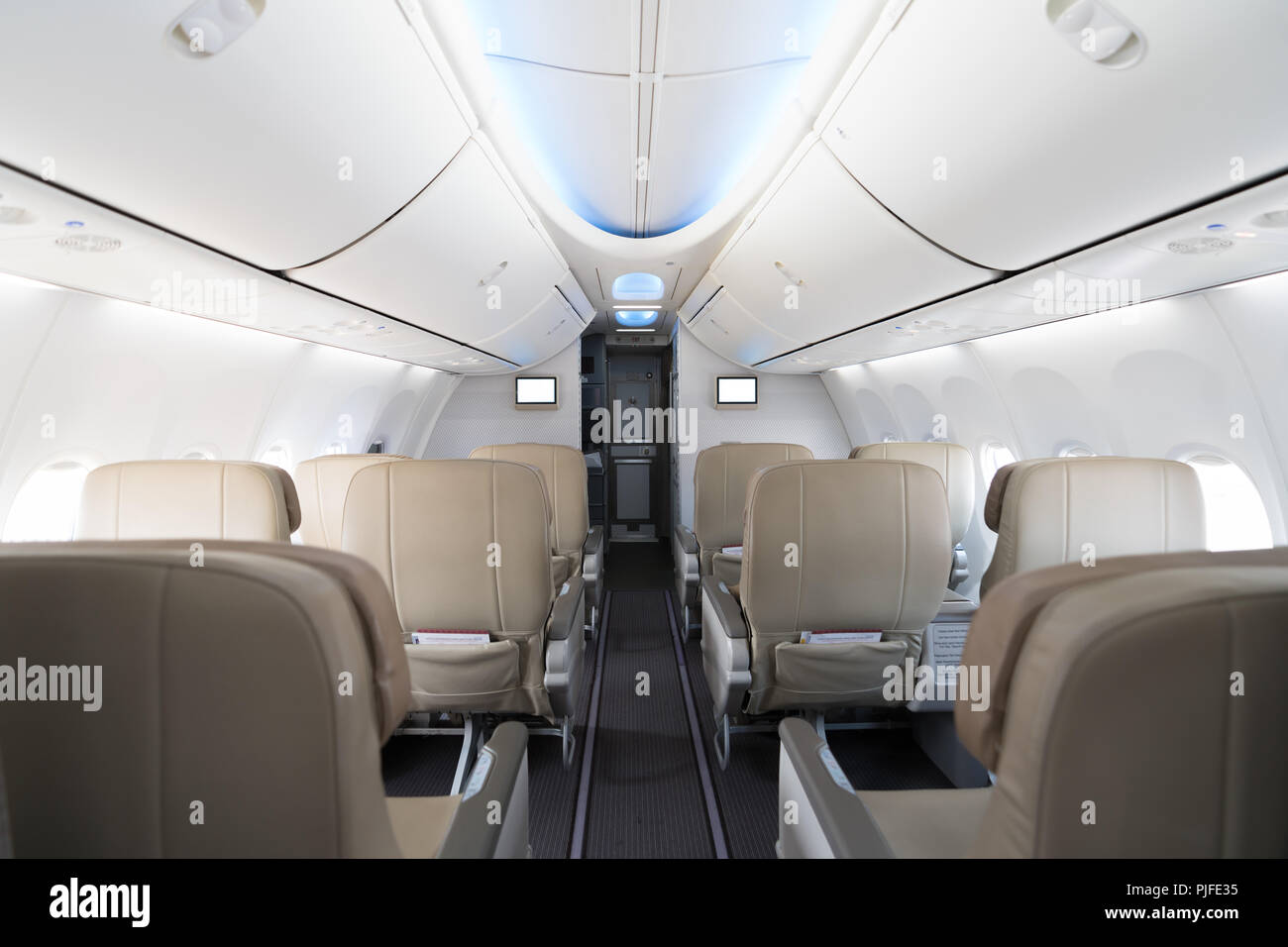 Empty passenger airplane seats in cabin. Interior in modern airplane. Stock Photo