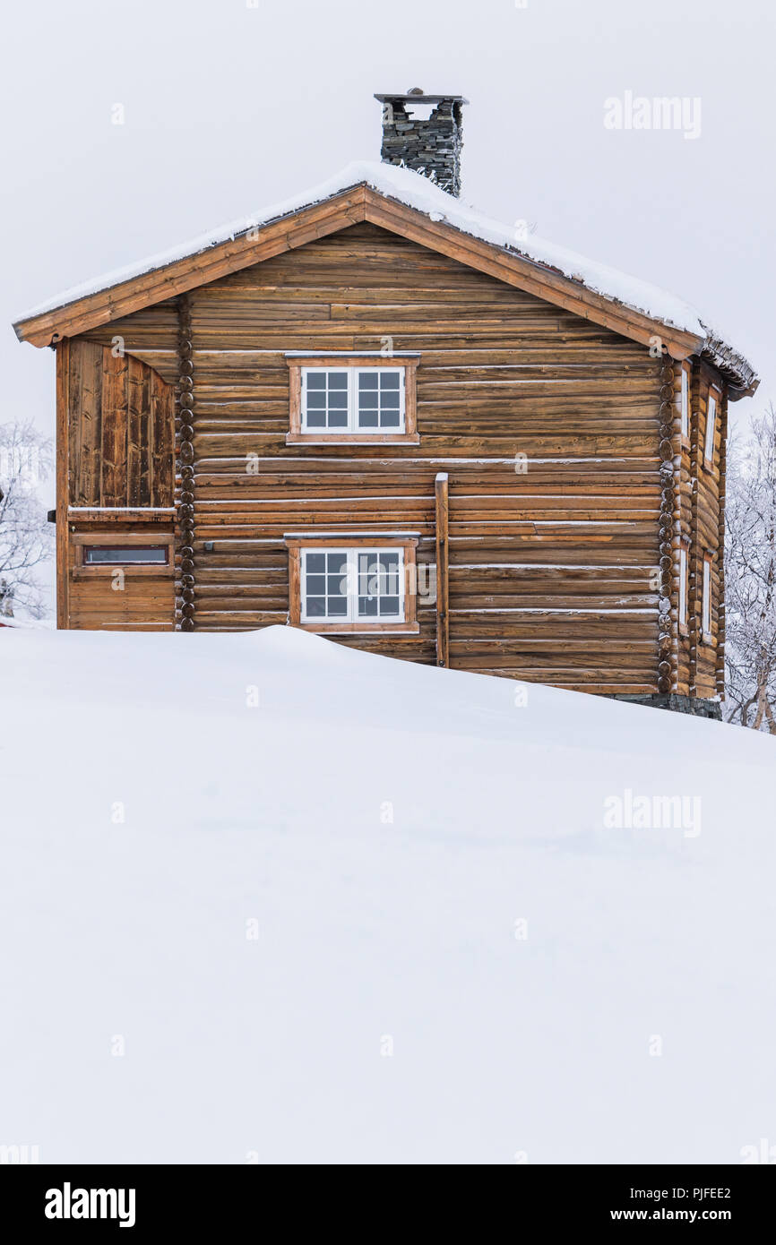 Winter Log Cabins In The Snow In Norway Surrounded By A Frosty