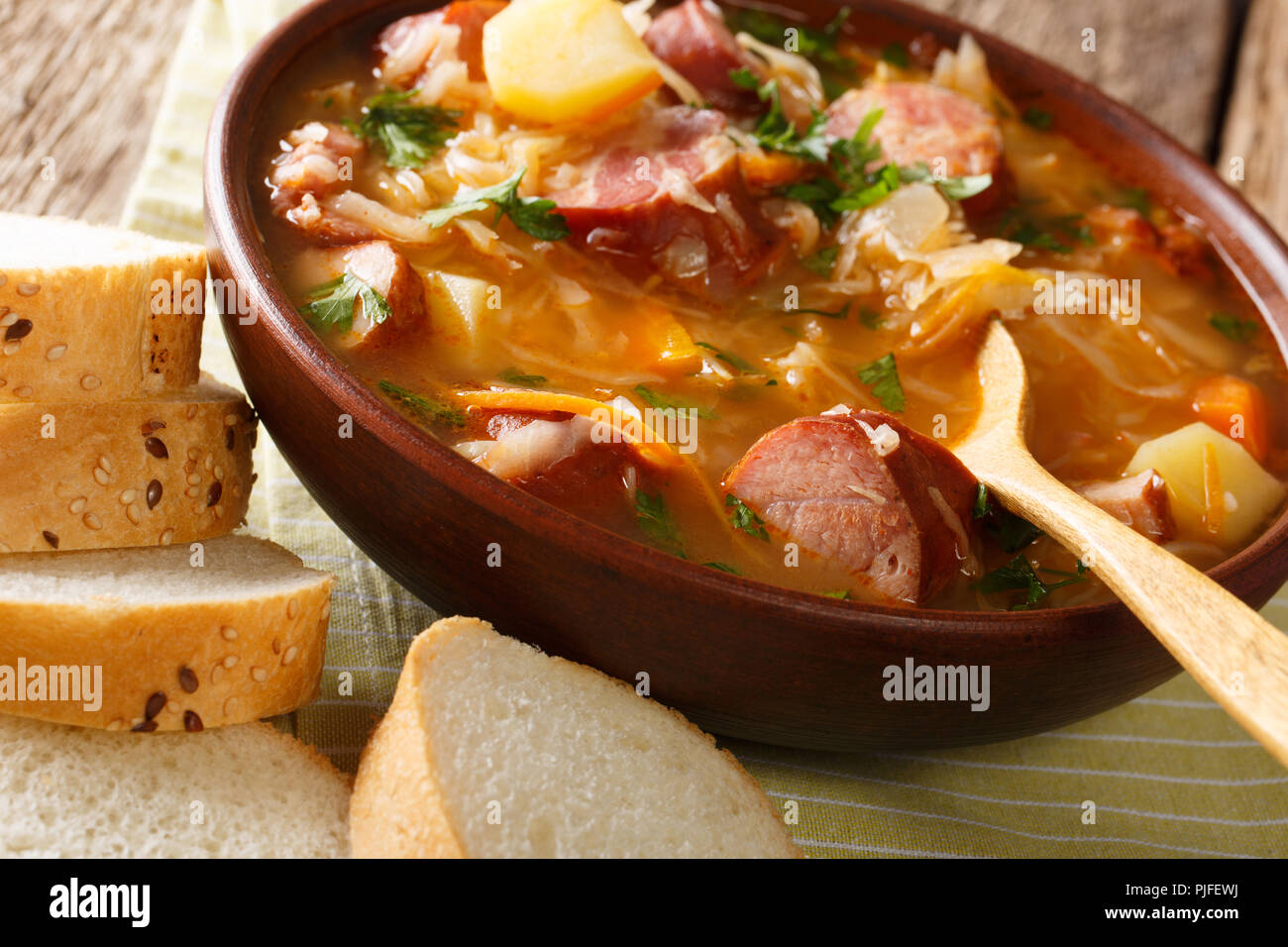 Czech recipe Sauerkraut Soup (Zelnacka) closeup in a bowl on the