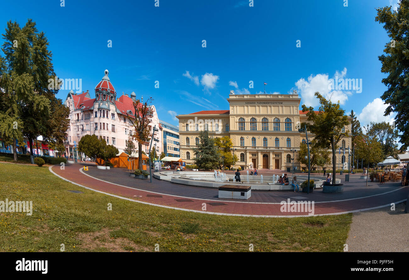 Dugonics square in the center of Szeged with University building on the right,and the Ungar-Mayer secession style palace on the left. Stock Photo