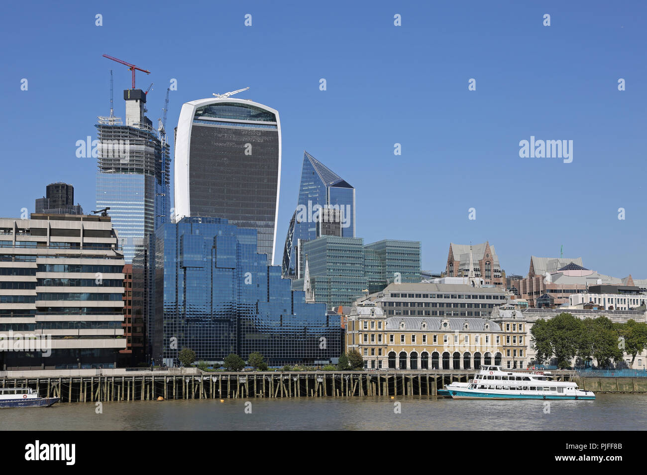 City of London Skyline from the River Thames showing the 'Walkie-Talkie' building, centre, and the old Billingsgate Fish Market, right. Stock Photo