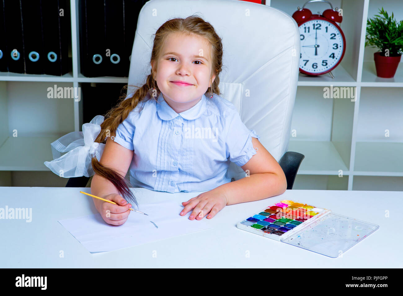cute little girl painting with watercolor at home Stock Photo - Alamy