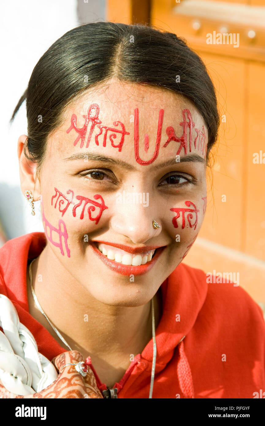A portrait of a Hindu devotee they clelebrate Holi Festival writing radhe krishna on face at nandgaon  Mathura  Uttar Pradesh  India Asia, Stock Photo