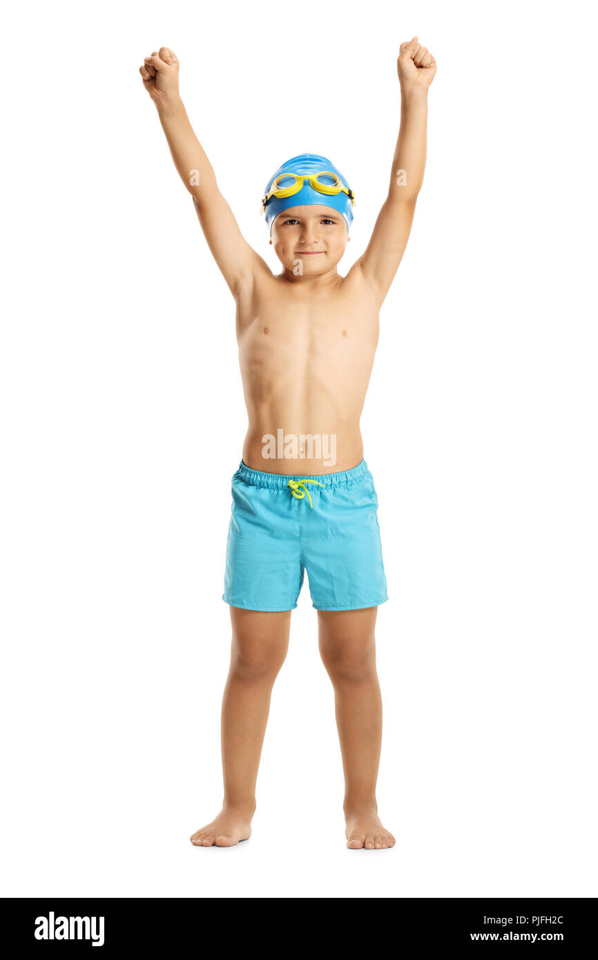 Full length portrait of a boy wearing swimming trunks holding his hands up isolated on white background Stock Photo