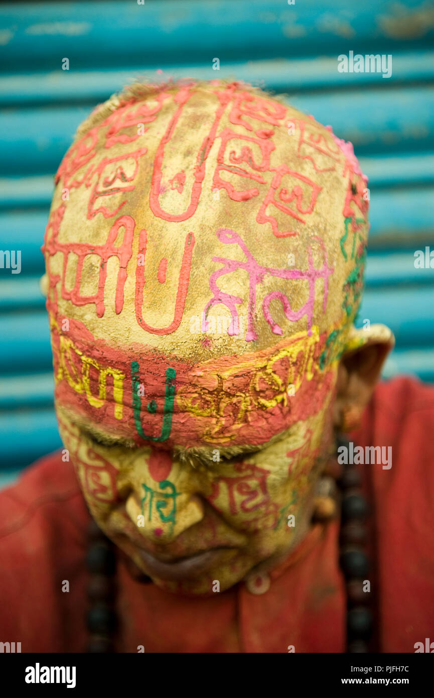 A portrait of a Hindu devotee they clelebrate Holi Festival writing radhe krishna on face at nandgaon  Mathura  Uttar Pradesh  India Asia, Stock Photo
