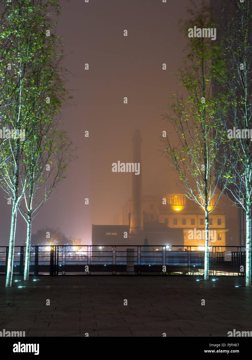 Liverpool, England, UK - November 1, 2015: The Victorian Canning Dock Pump House and chimney shrouded in fog in Liverpool Docks. Stock Photo