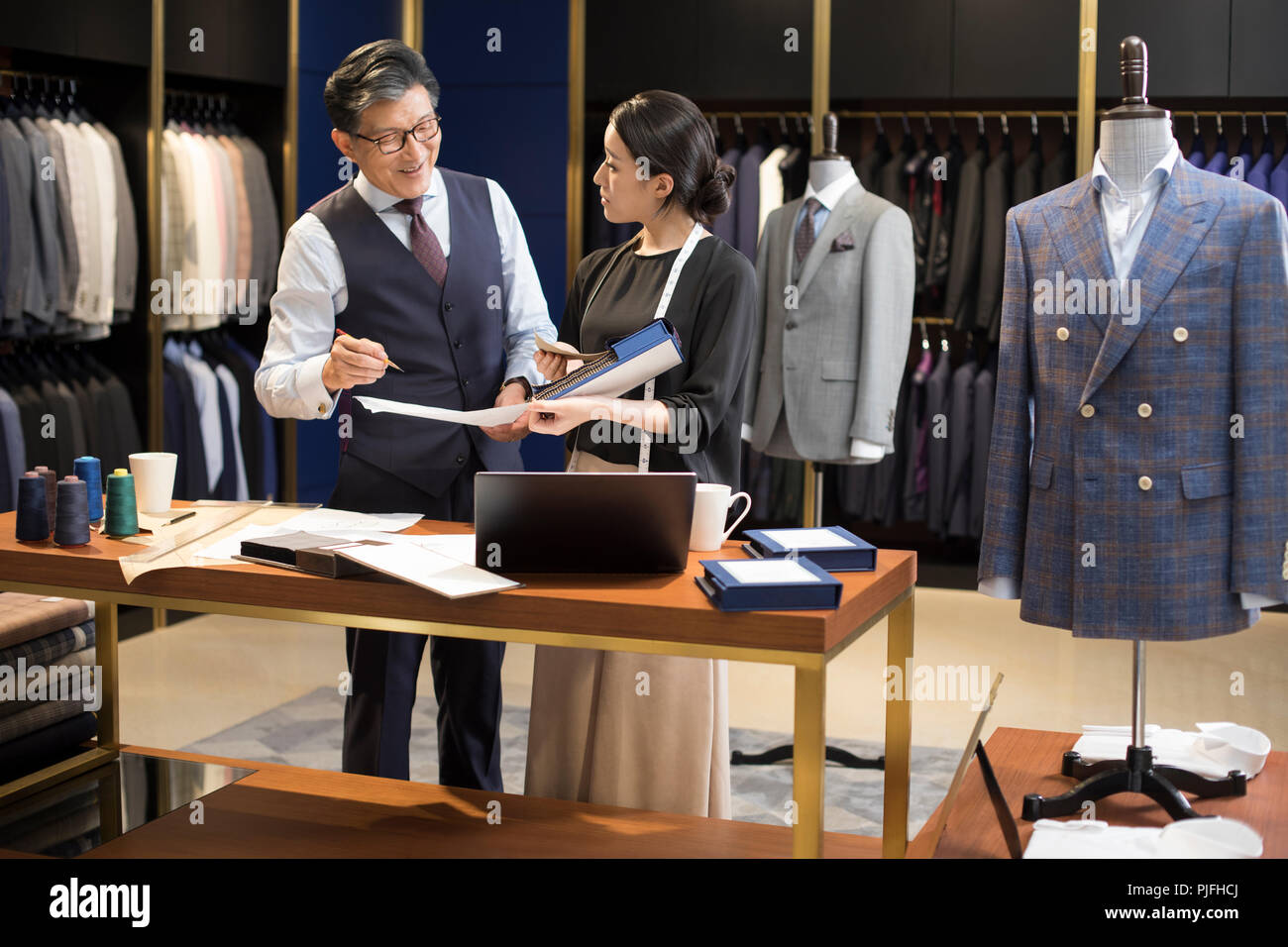 Confident fashion designers working Stock Photo