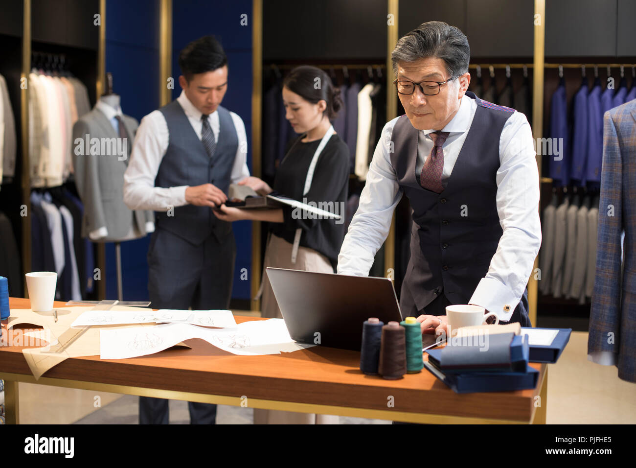 Confident fashion designers working Stock Photo