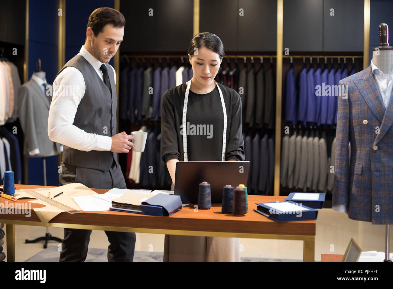 Confident fashion designers working Stock Photo