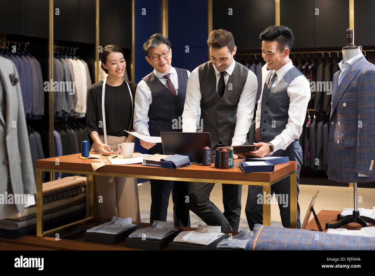 Confident fashion designers working Stock Photo