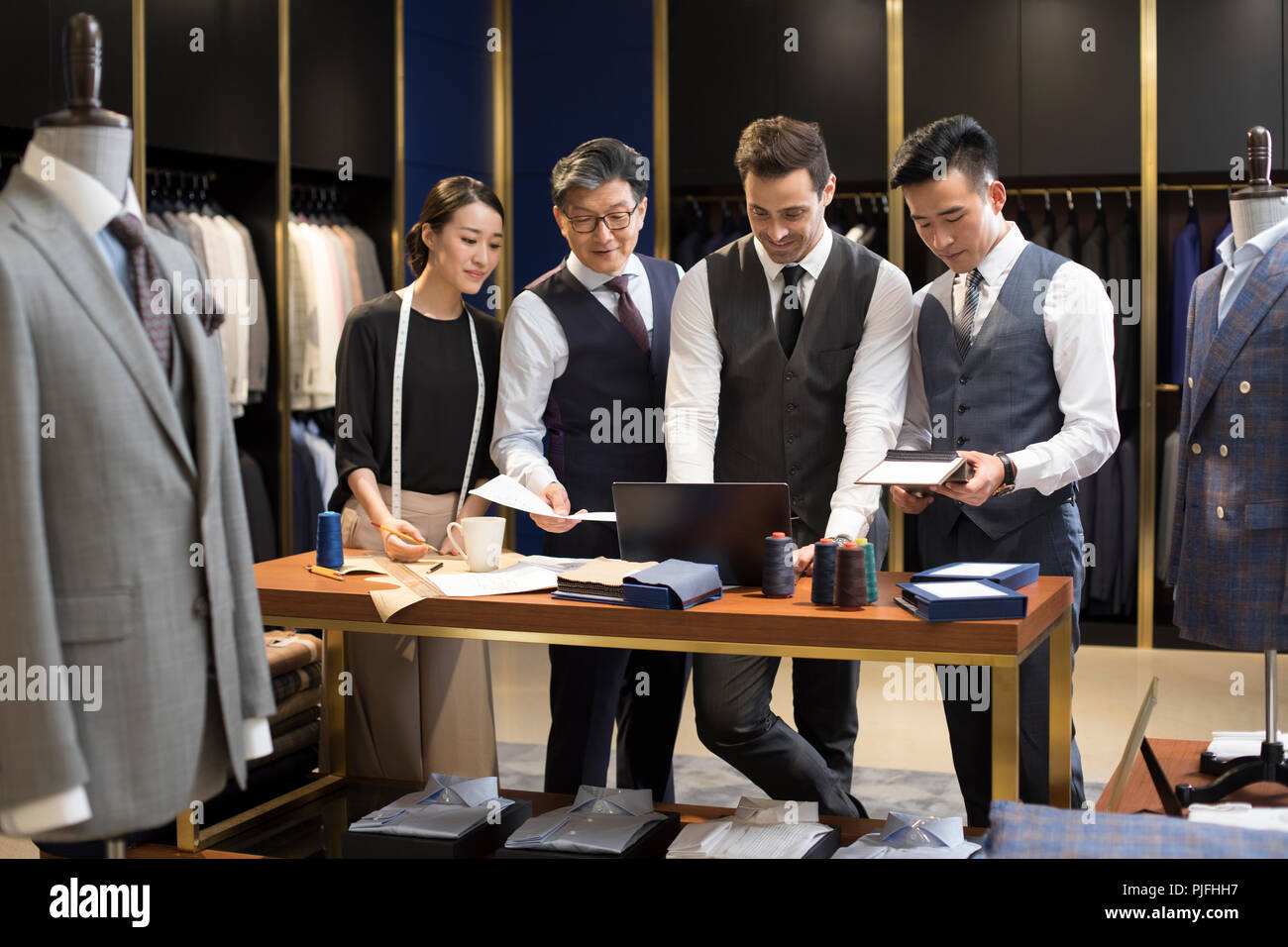 Confident fashion designers working Stock Photo