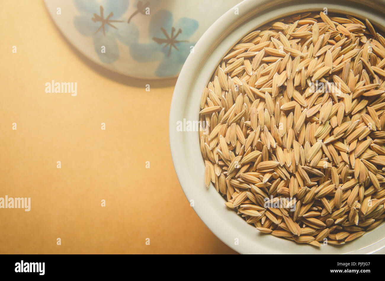 Top view of paddy rice and rice seed on the wooden floor, Background ...