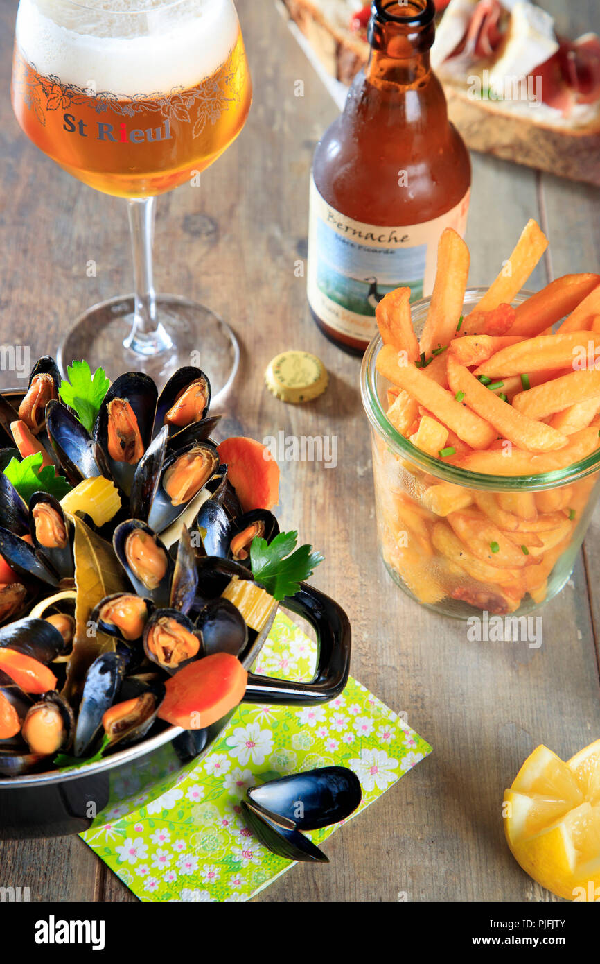 Mussels, French fries and half a pint of beer Stock Photo