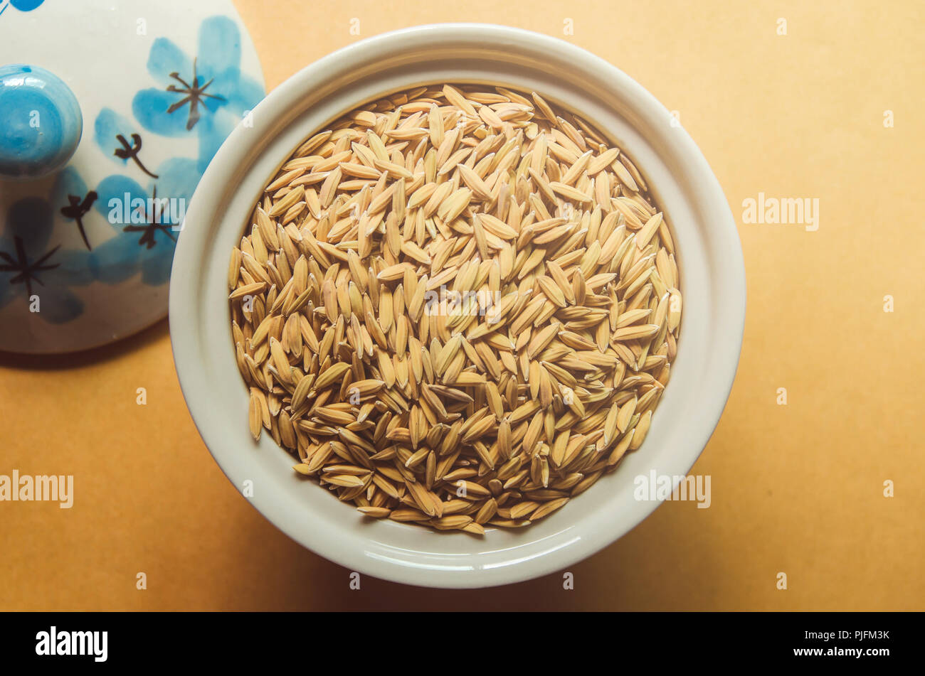 Top view of paddy rice and rice seed on the wooden floor, Background ...