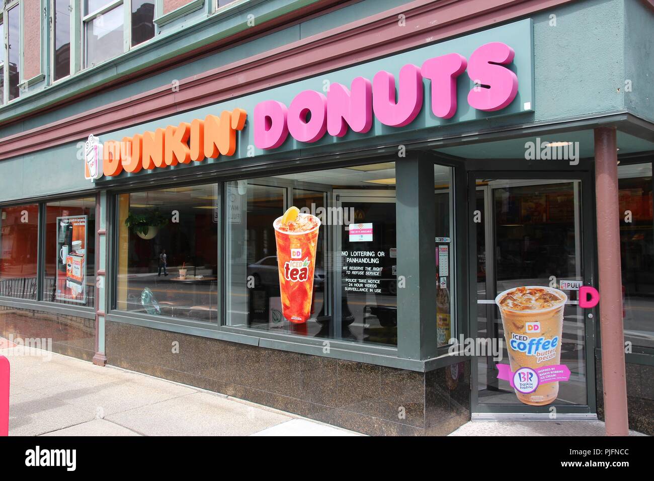 PROVIDENCE, USA - JUNE 8, 2013: Exterior of Dunkin Donuts shop in Providence. The company is the largest coffee and baked goods franchise in the world Stock Photo