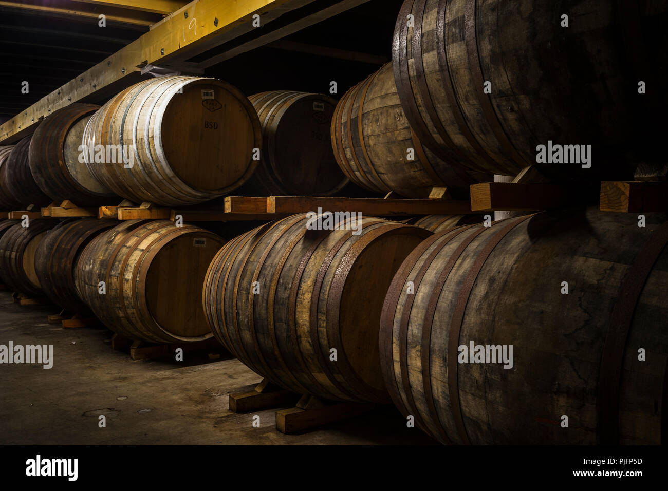 Barrels of whisky at Bunnahabhain, ageing in the warhouse, Islay, Scotland Stock Photo