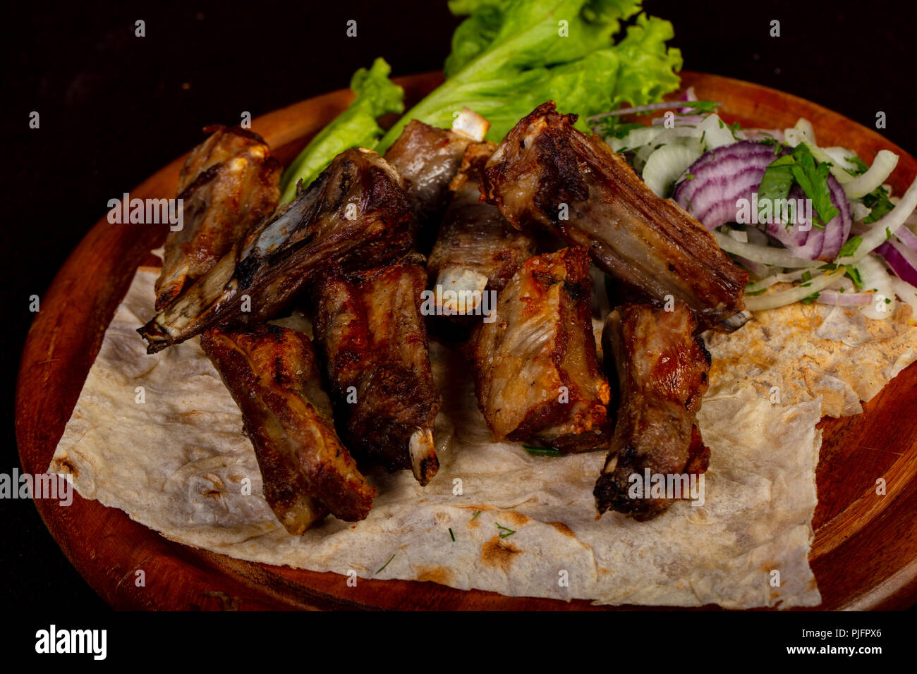 Grilled Mutton ribs with onion Stock Photo Alamy