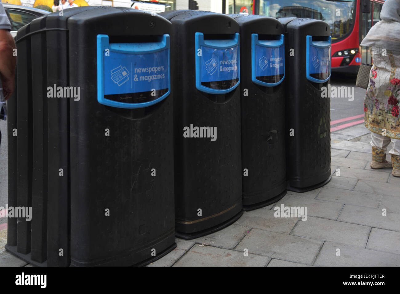 Victoria Street Westminster London England Newspaper and Magazines Recycle Bins Stock Photo