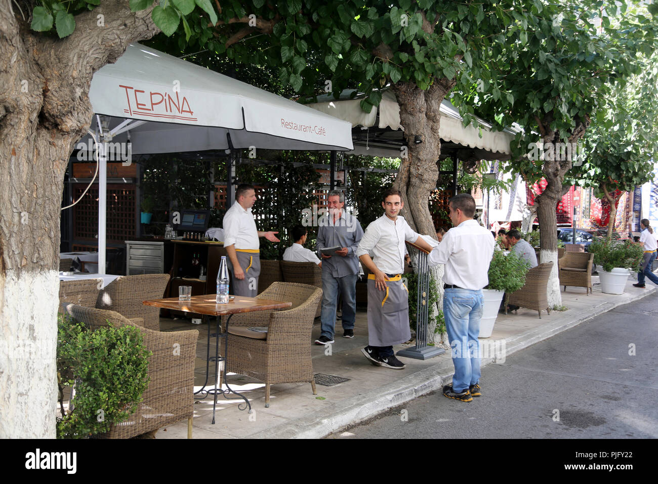 Plaka Athens Greece Tepina Restaurant Waiters talking to Customers Stock Photo
