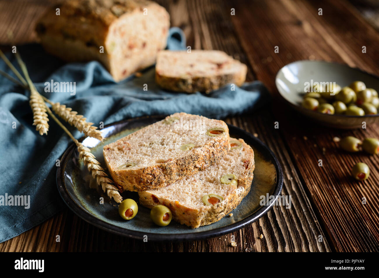 Homemade loaf of bread with sun dried tomato and green olives Stock Photo Alamy