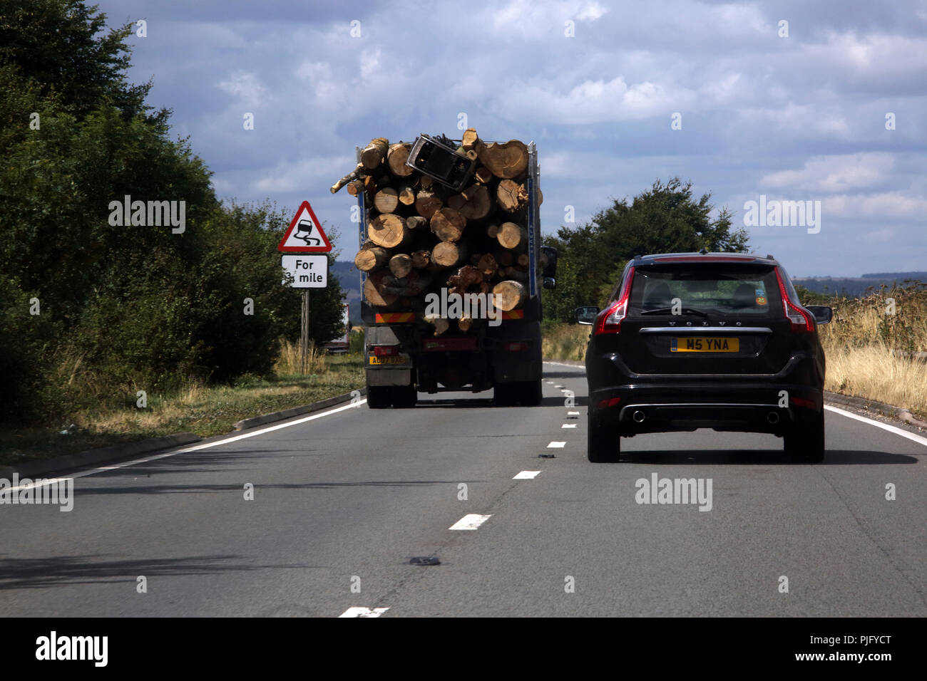 Wiltshire England Lorry Transporting Timber on A303 Dual Carriageway Stock Photo