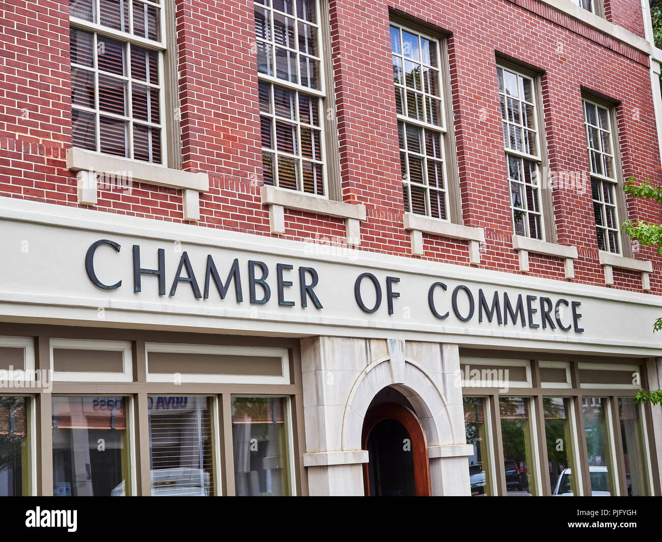 Chamber of Commerce sign on front exterior of the business promotion organization building in Montgomery Alabama, USA. Stock Photo