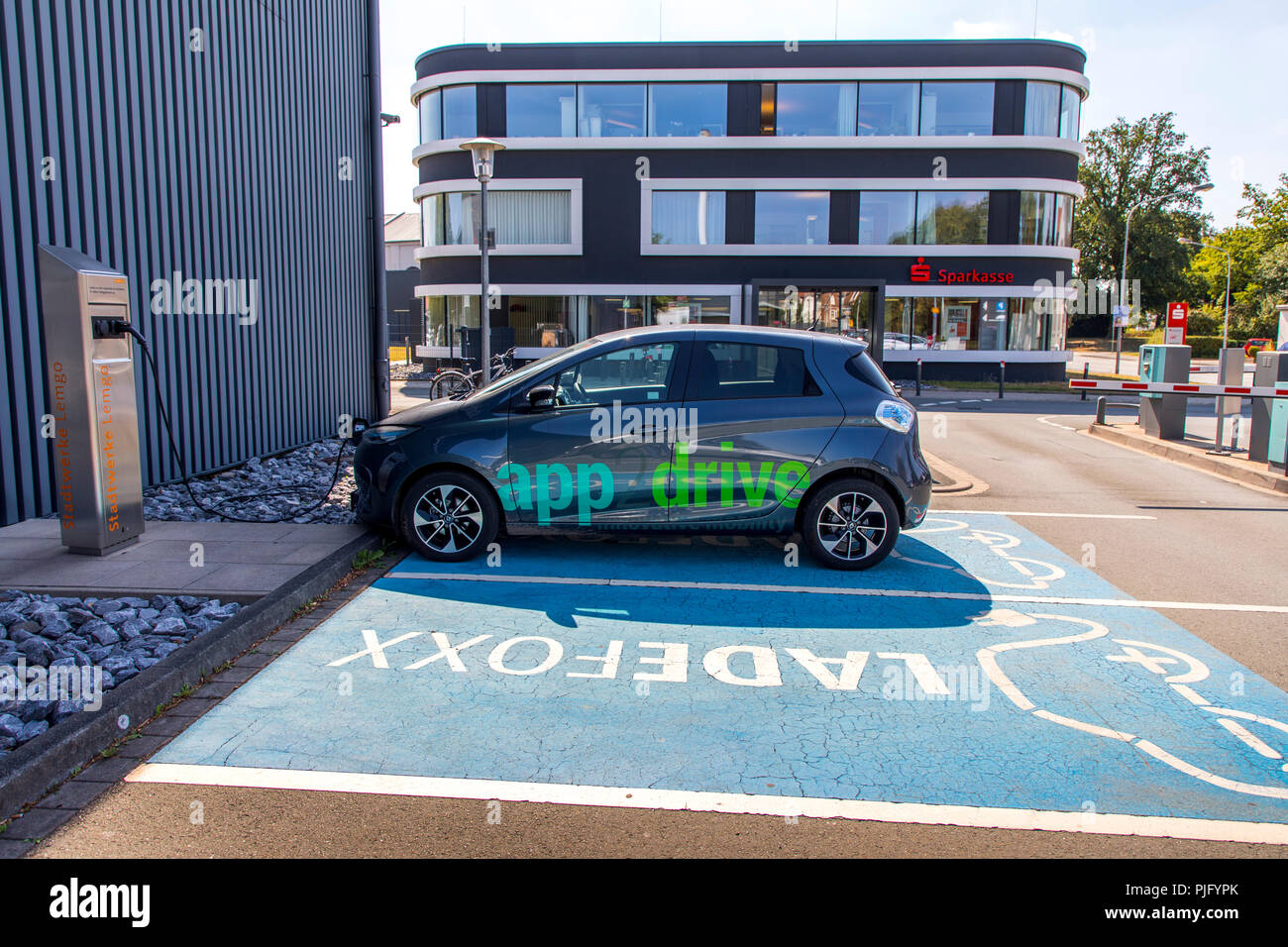 Charging station, extra parking for electric vehicles in the customer parking lot of Stadtwerke Lemgo, city electric company, Germany Stock Photo