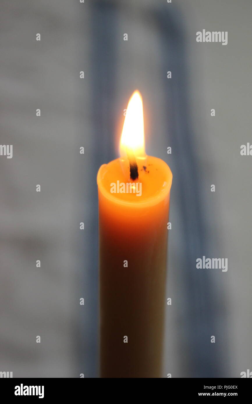 Burning beeswax candle Stock Photo Alamy