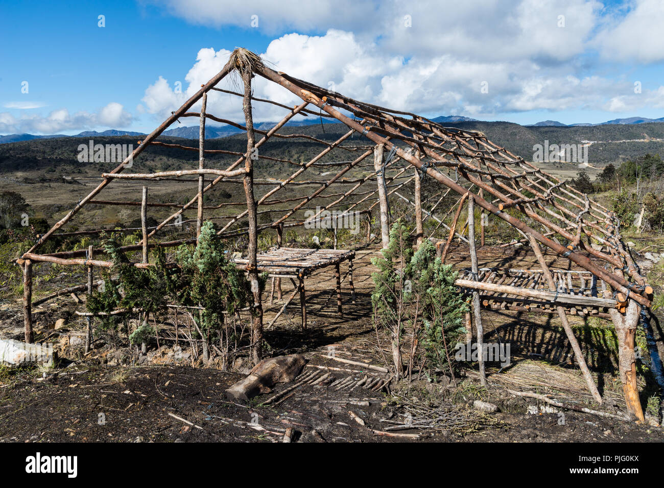 Skeletal camp used by adventure travelers and locals in the remote Central Range. Papua, Indonesia. Stock Photo
