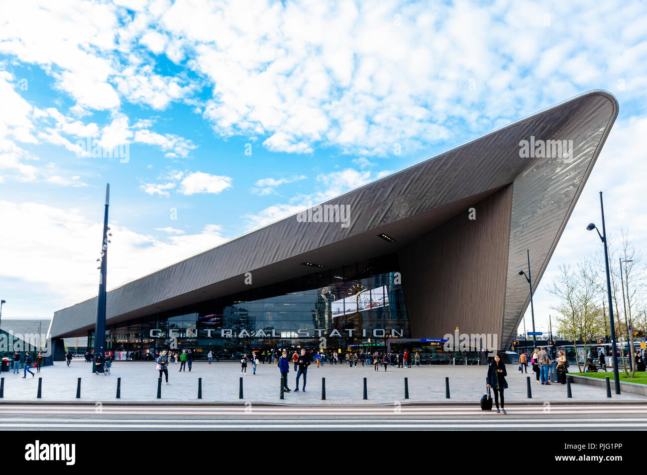 ROTTERDAM, Netherlands - April 15 2017: Rotterdam Centraal Rail Station modern architecture landscape view with commuters Stock Photo