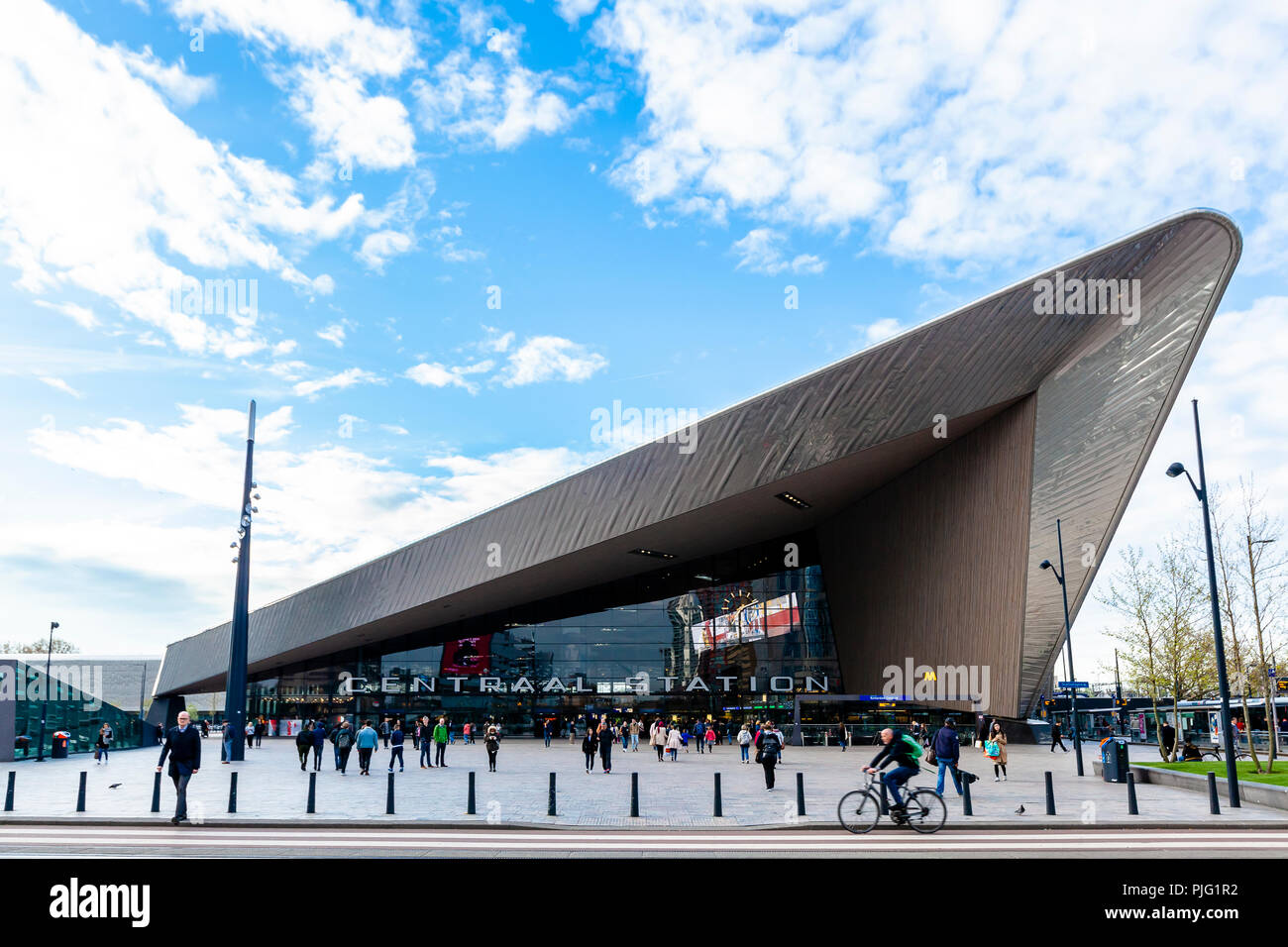 ROTTERDAM, Netherlands - April 15 2017: Rotterdam Centraal Rail Station modern architecture landscape view with commuters Stock Photo