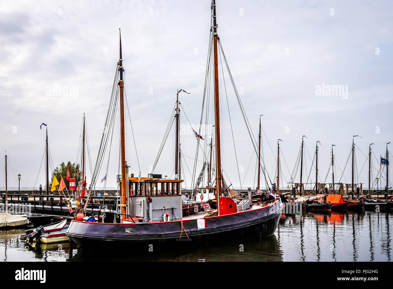 Old fashioned fishing boats in the harbor of the historic fishing village of Urk in the