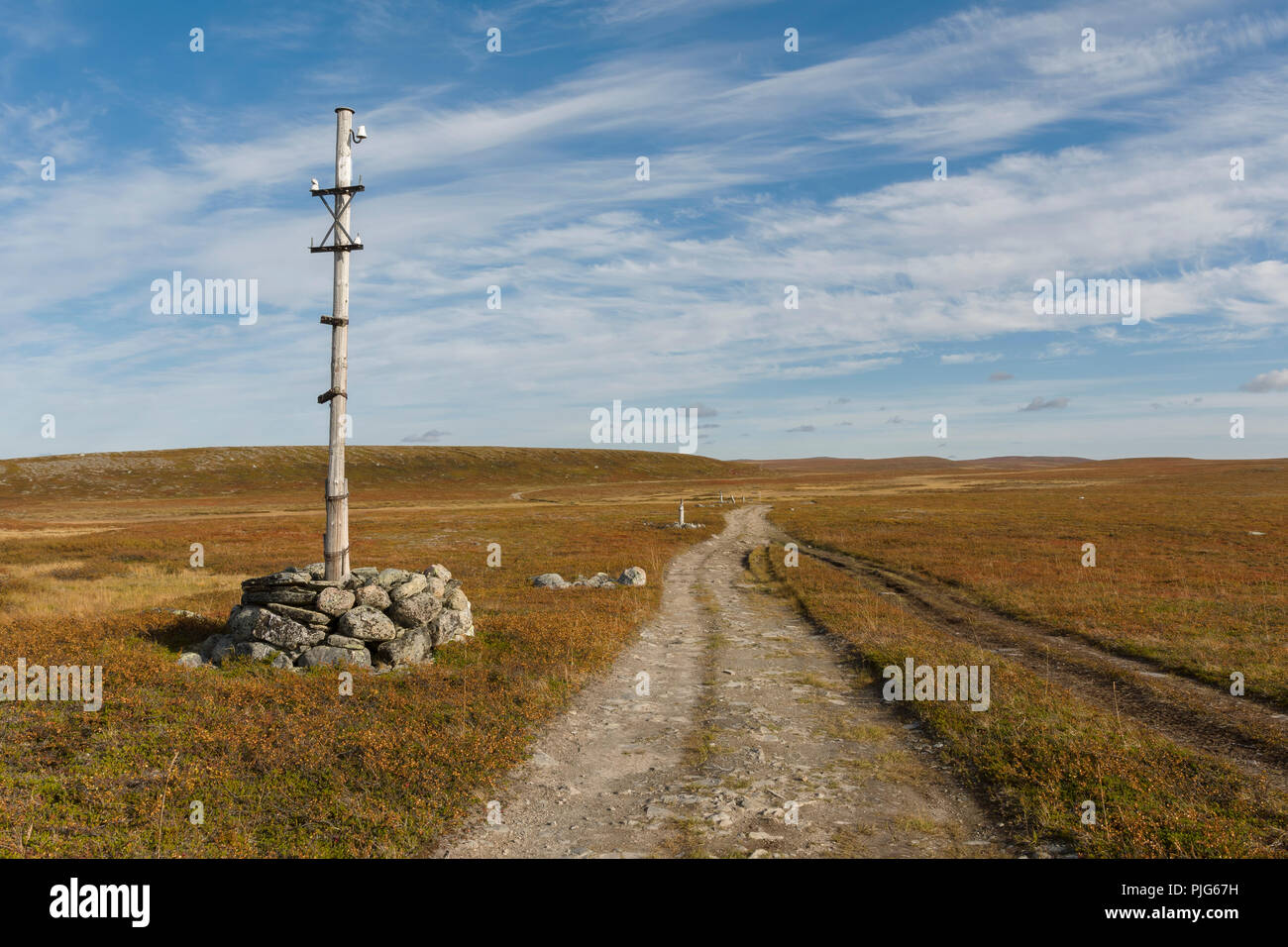 Old telegraph post at the mountain plateau "Finnmarksvidda" in Alta, Finnmark, Norway. Stock Photo