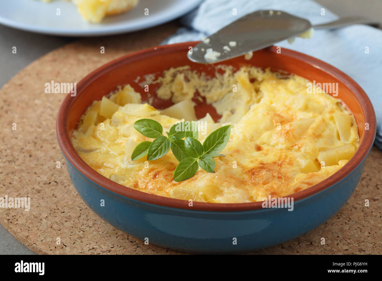 Spanish omelet frittata topped with basil leaf Stock Photo Alamy