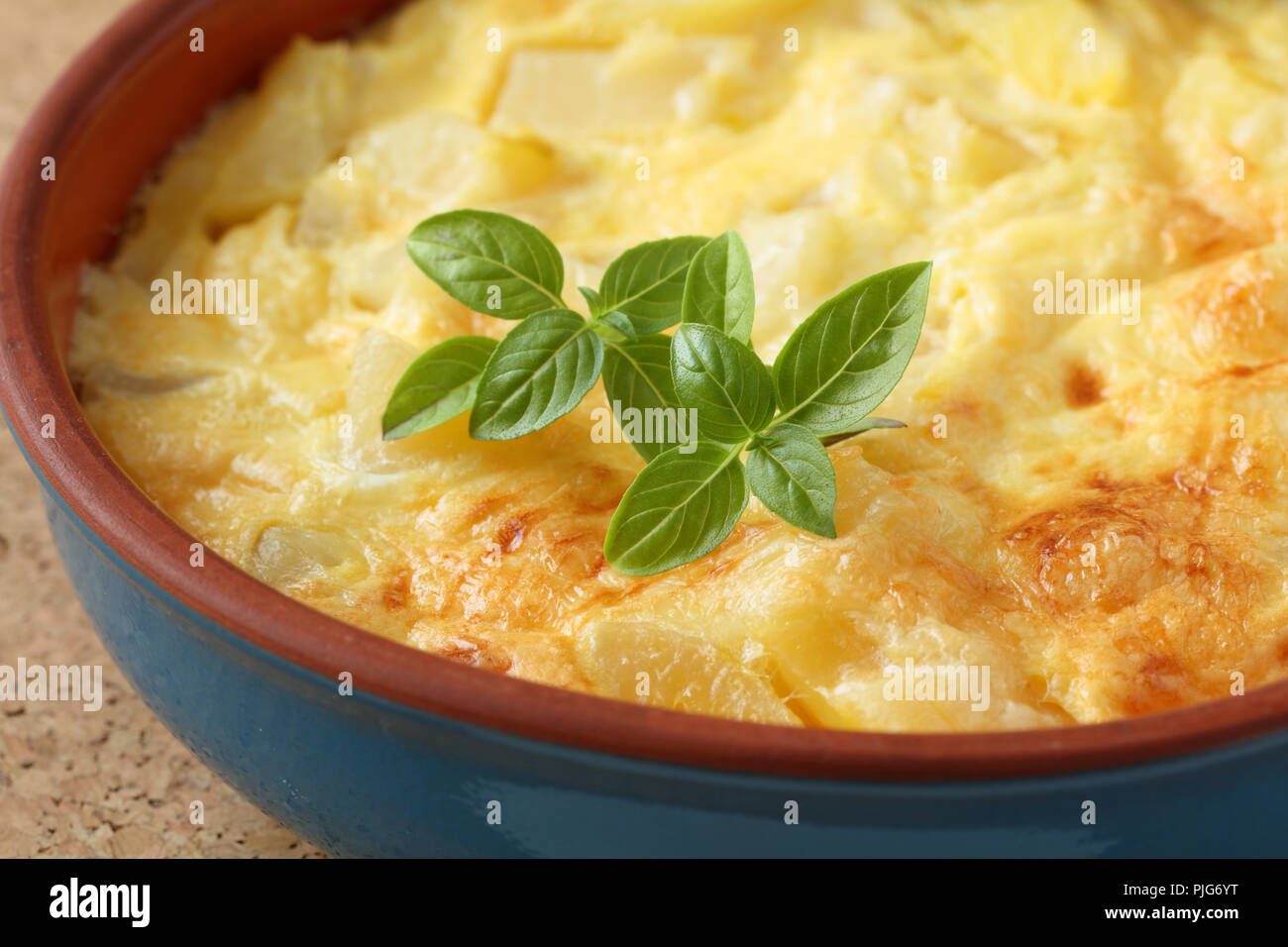 Spanish omelet frittata topped with basil leaf Stock Photo Alamy
