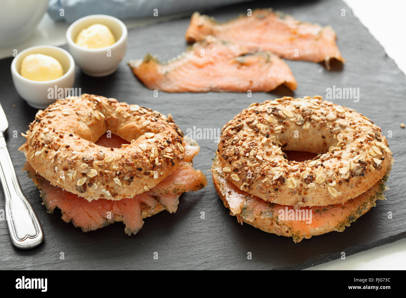 Salmon bagel sandwiches on a slate cutting board Stock Photo Alamy