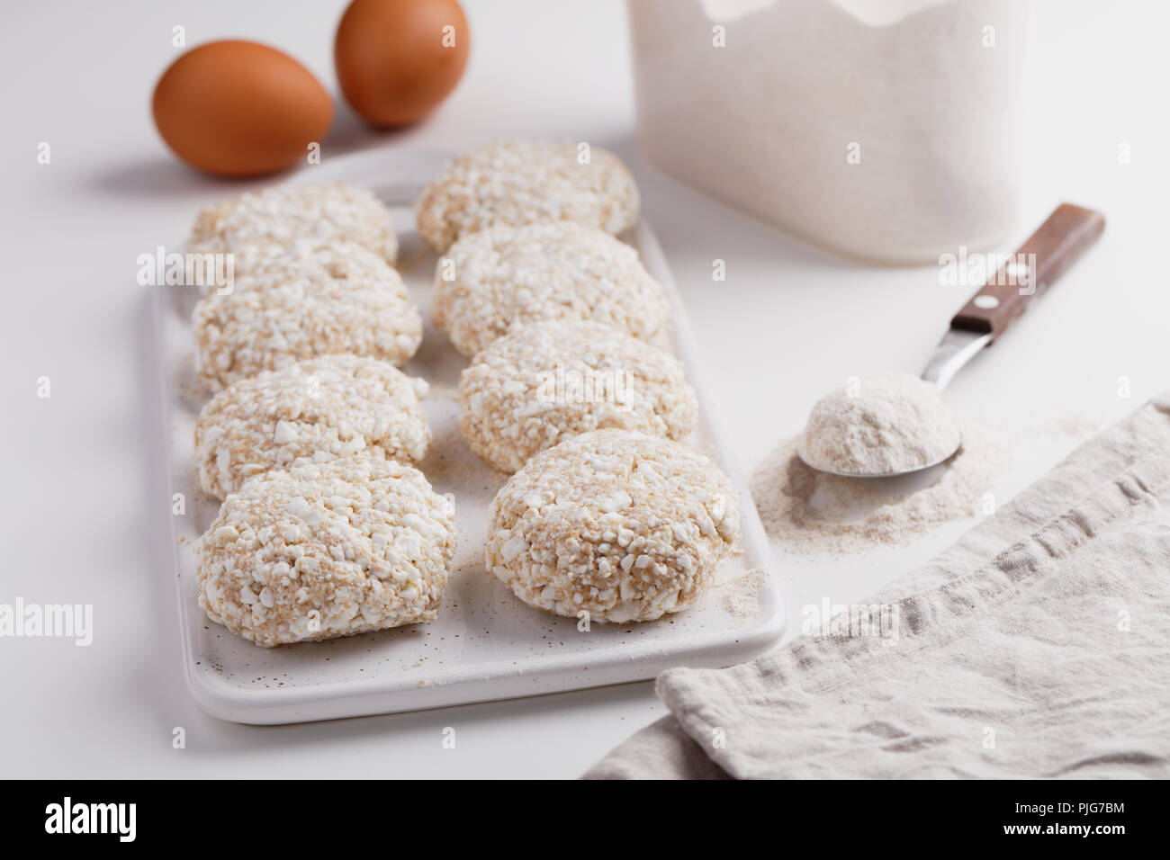 Cooking Syrniki, the traditional Russian cheese pancakes Stock Photo